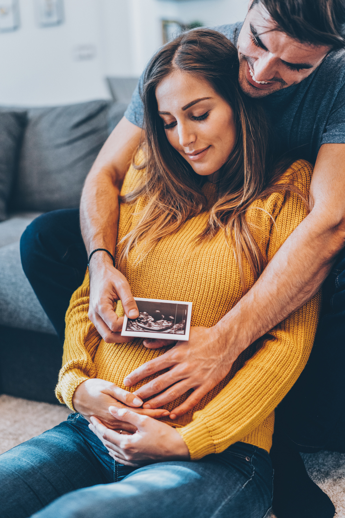 Couple with baby ultrasound photo